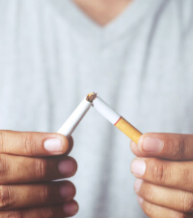 Man holding a two cigarettes